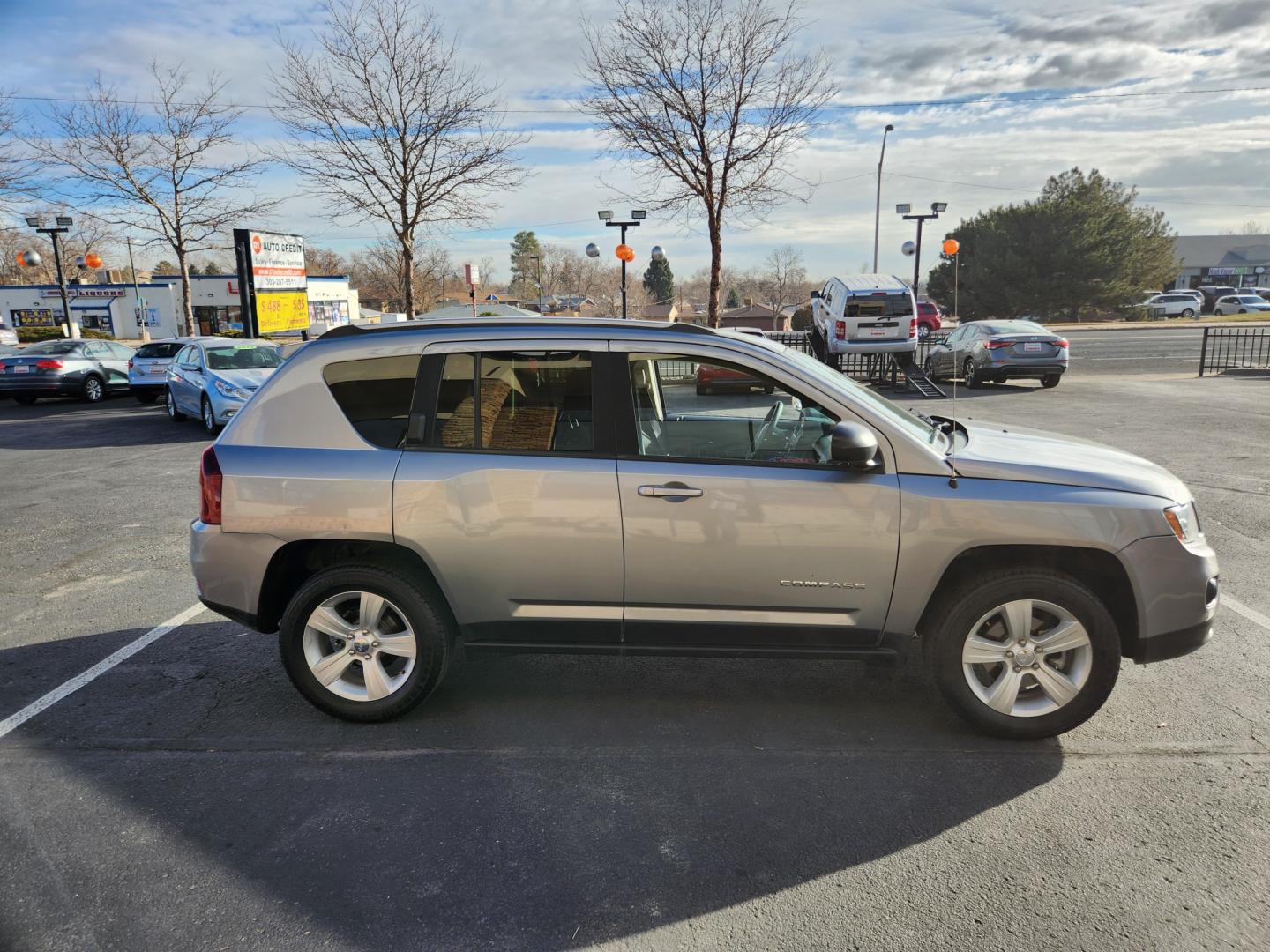 2015 Billet Silver Metallic Clearcoat /Dark Slate Gray Jeep Compass Sport (1C4NJDBB9FD) with an 2.4L I4 DOHC 16V Dual VVT engine, Automatic transmission, located at 8595 Washington St., Thornton, CO, 80229, (303) 287-5511, 39.852348, -104.978447 - 2015 Jeep Compass<br><br>D1 Auto NEVER charges dealer fees! All cars have clean titles and have been inspected for mechanical issues. We have financing for everyone. Good credit, bad credit, first time buyers.<br><br>Please call Lakewood Location 303-274-7692 or Thornton 303-287-5511 to schedule a t - Photo#4